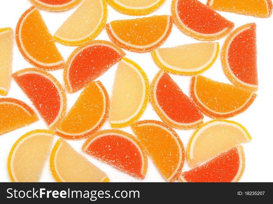 Colored jelly sweets laid on a white background