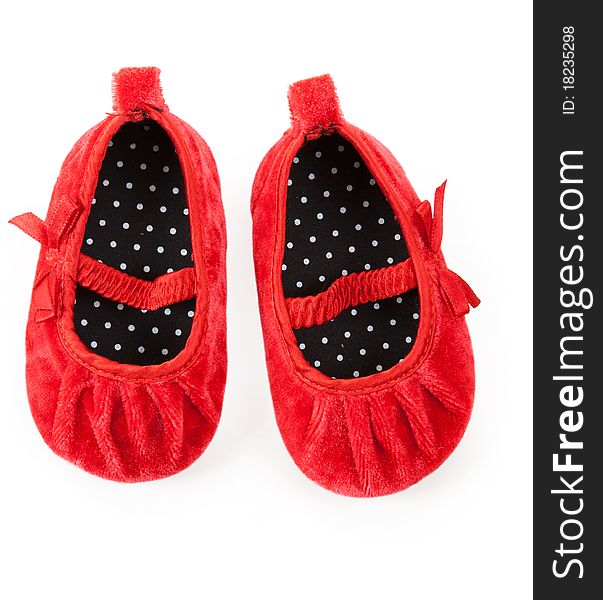 Red baby booties isolated on white background