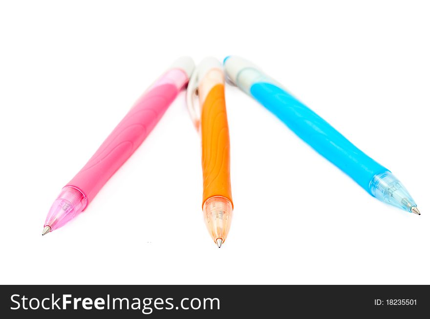 Pink, blue, orange pen on a white background