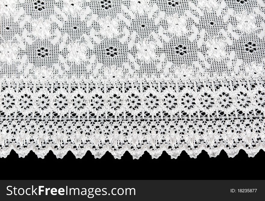 White lace with a floral pattern on a black background