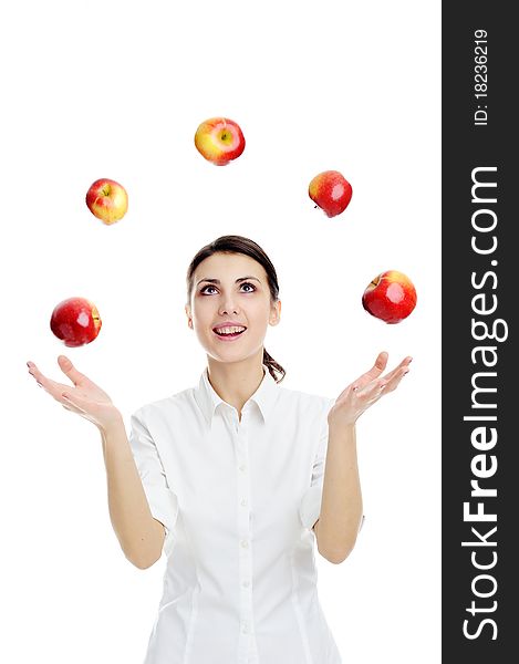 An image of happy young woman playing with red apples