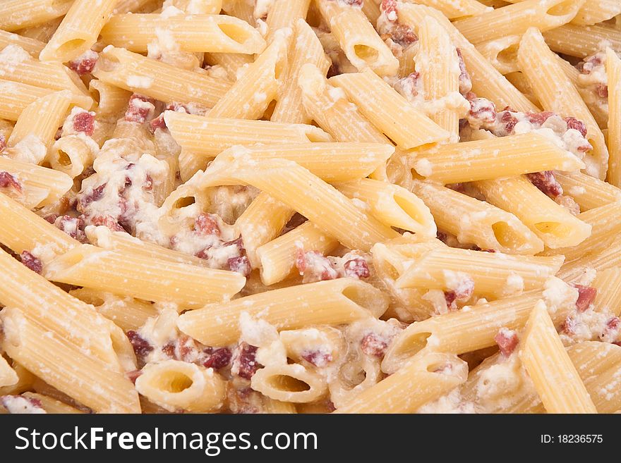 Closeup of pasta with bacon and cheese freshly cooked