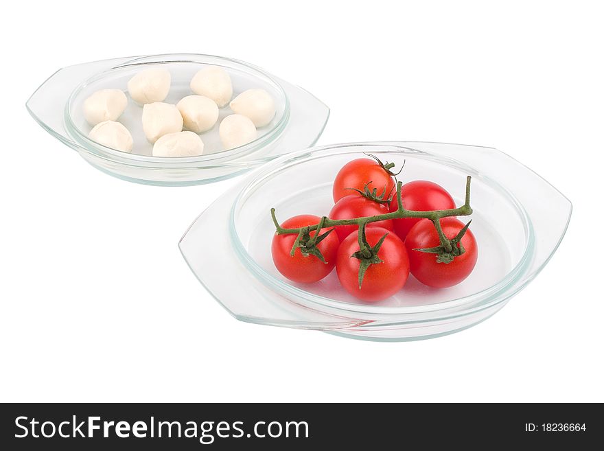 Fresh red tomatoes and mozzarella isolated on white background