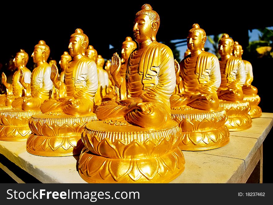 Many of Golden Buddha Statue meditation pose in Buddha Temple in Asia , Thailand