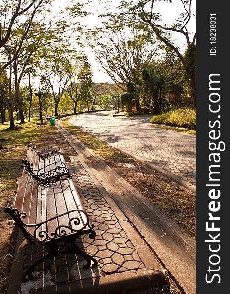 Bench In Park At Sunset