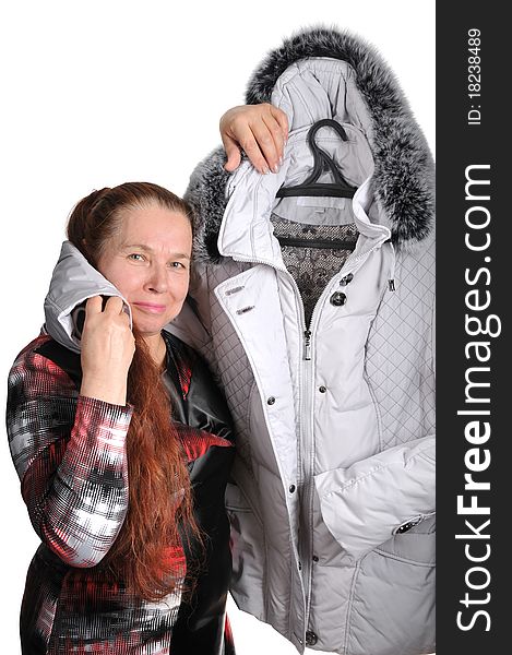 The elderly woman and new winter jacket with a fur collar. The elderly woman and new winter jacket with a fur collar.