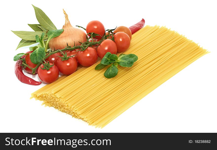 Italian pasta spagetti with vegetables on a white