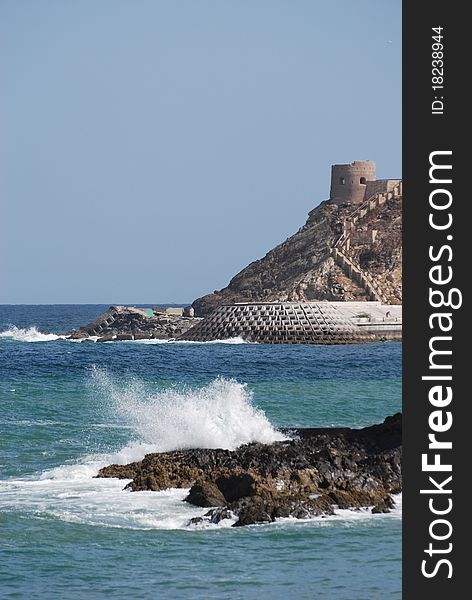 Waves crash against the coastal rocks at the port of Oman. Waves crash against the coastal rocks at the port of Oman