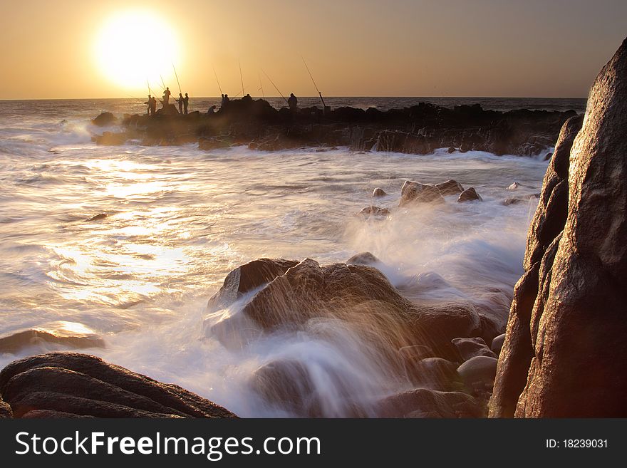 Some fisherman standing at the rocks of Their favourite fishing spot. Some fisherman standing at the rocks of Their favourite fishing spot