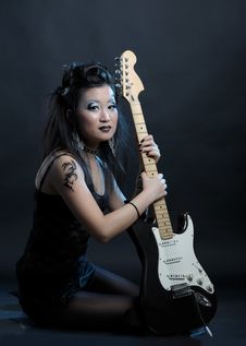 Woman Rock With Guitar Stock Image