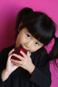 Chinese Asian Girl Eating Apple Stock Photos Chinese Asian Girl Eating Apple Stock Photos