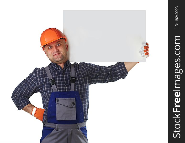 The man in the workers' clothes in a helmet on a white background. The man in the workers' clothes in a helmet on a white background