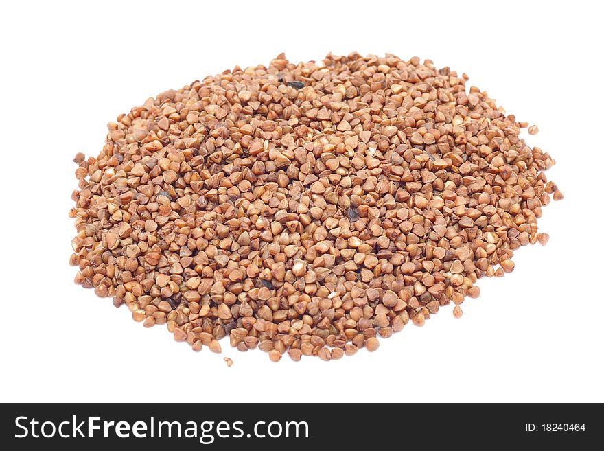 Grains of buckwheat on white background