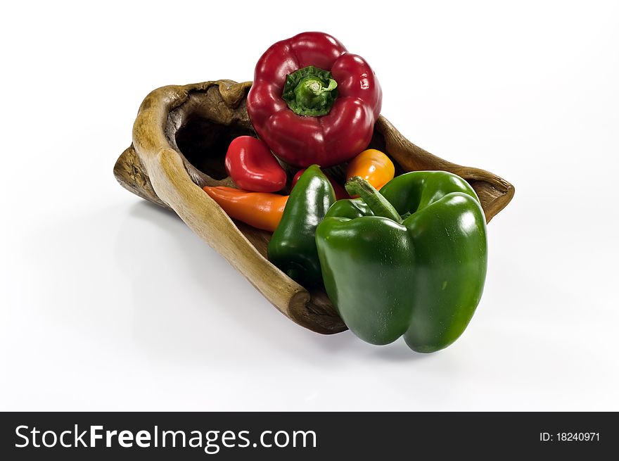 Colorful paprika on wooden tray