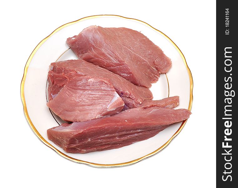 Fresh damp meat on plate insulated on white background. Fresh damp meat on plate insulated on white background