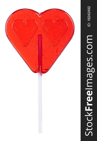 Heart shaped lollipop on white background