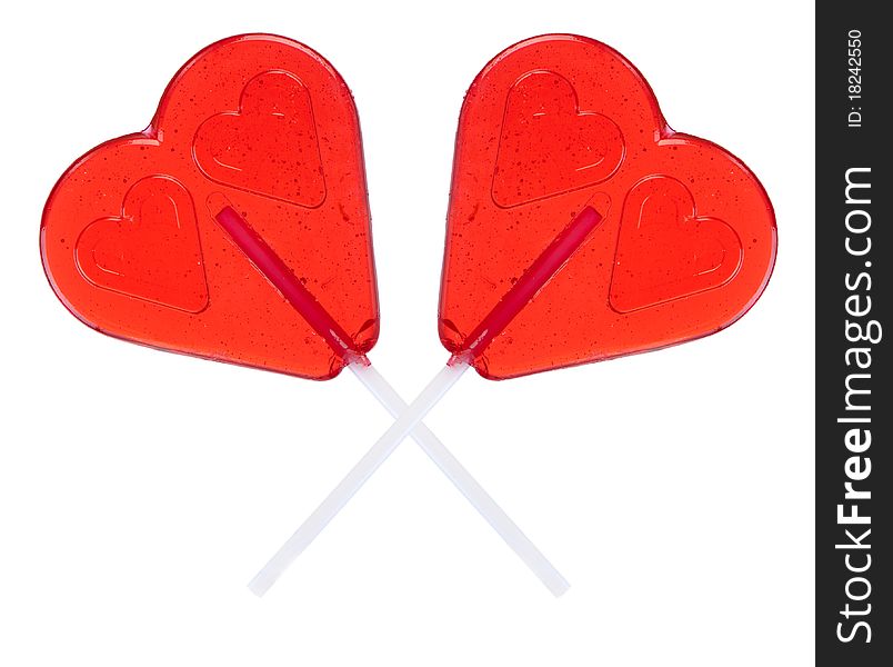 Two hearts shaped lollipop on white background