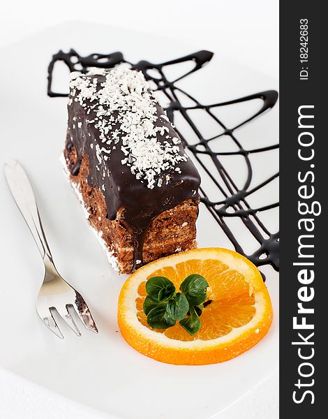 Chocolate dessert with orange and mint.