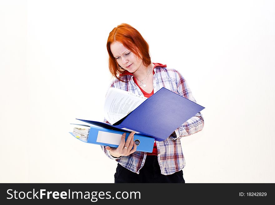 Redhead young woman with a folder in the hands