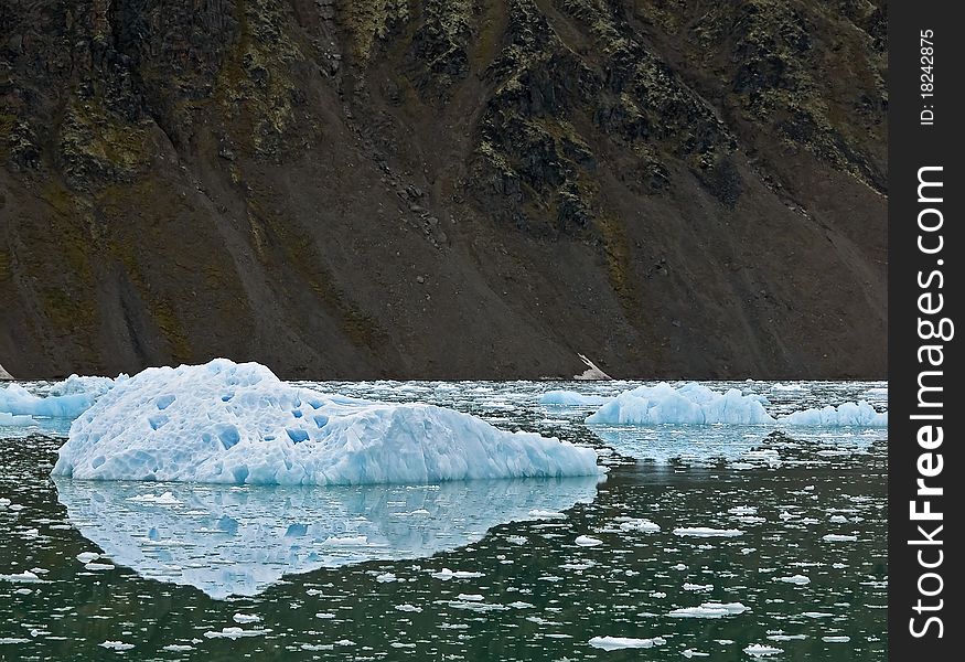 Strange blue chunk of ice broken off from a glacier.