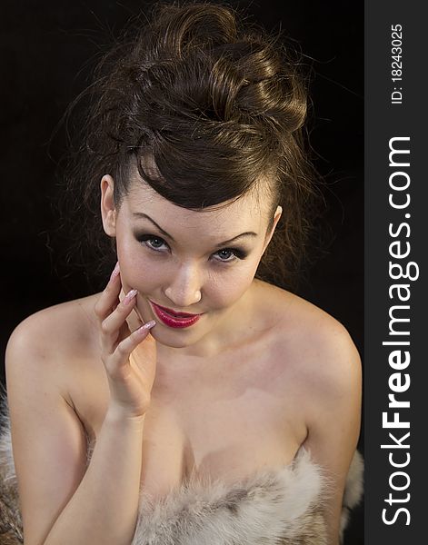 Beautiful Woman Touching Face Dressed Fur