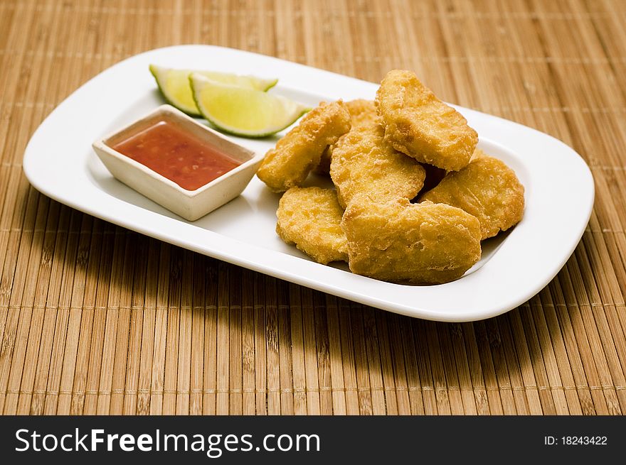 Plate of nuggets with dip isolated. Plate of nuggets with dip isolated