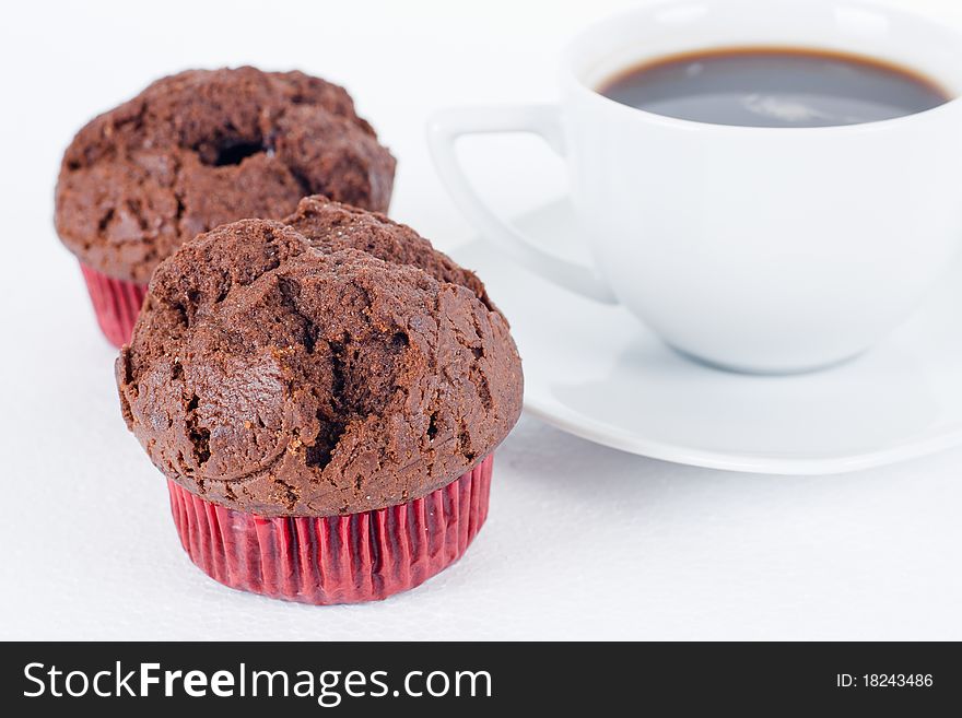 Chocolate muffins with cup of coffee. Chocolate muffins with cup of coffee.