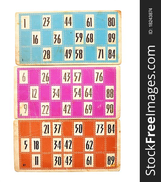 Old lotto cards and numbers on white