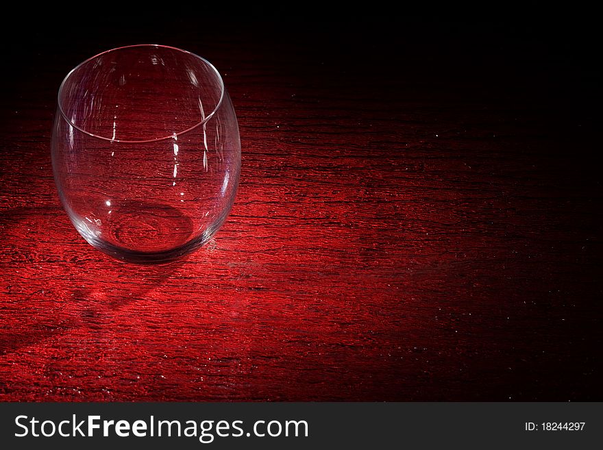 Photo of whiskey on red glasstable