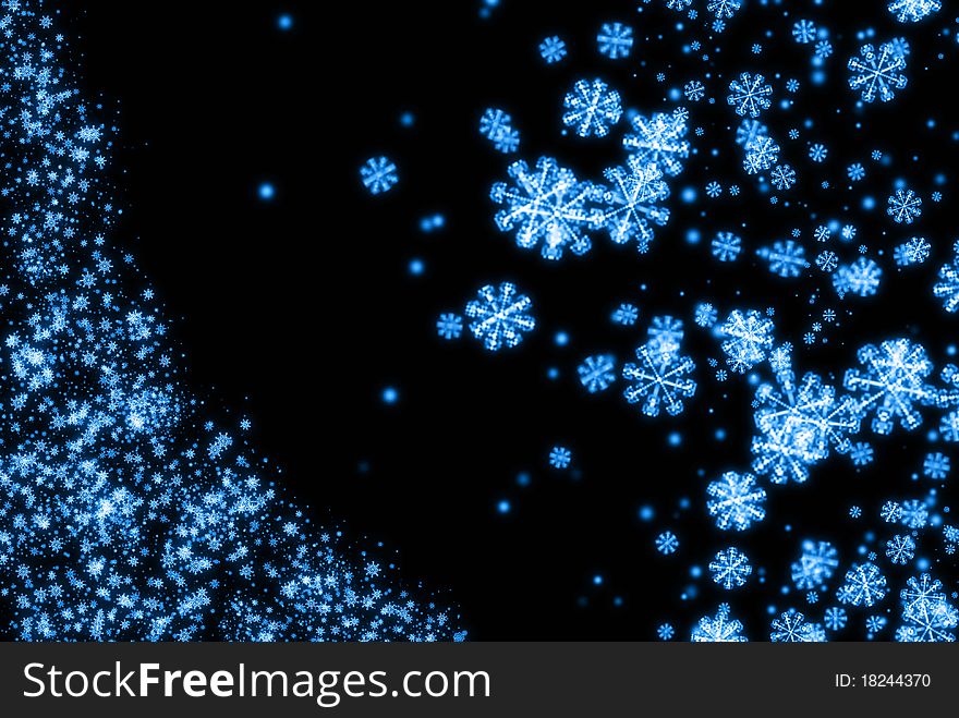 The blue snowflake on the black background. The blue snowflake on the black background