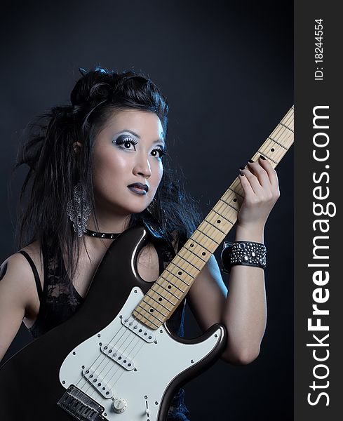 Woman rock star portrait with guitar. Woman rock star portrait with guitar