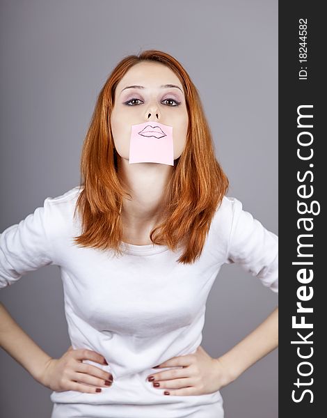 Portrait Of Red-haired Girl With Stickers On Mout