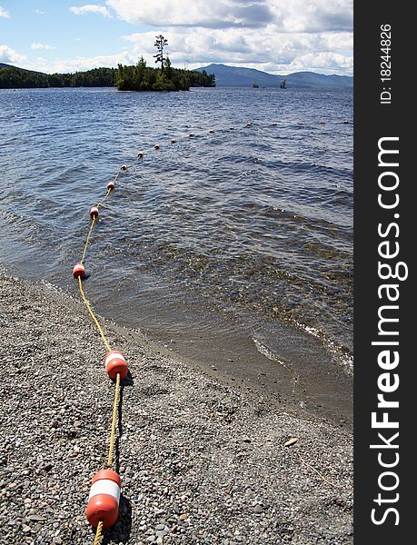 Roped buoys leading into pristine lake in Maine