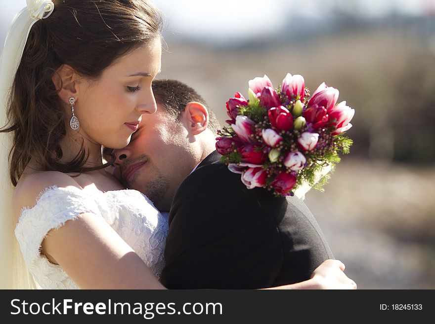 Young just married couple in romantic embrace. Young just married couple in romantic embrace.