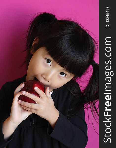 Chinese Asian Girl Eating  Apple