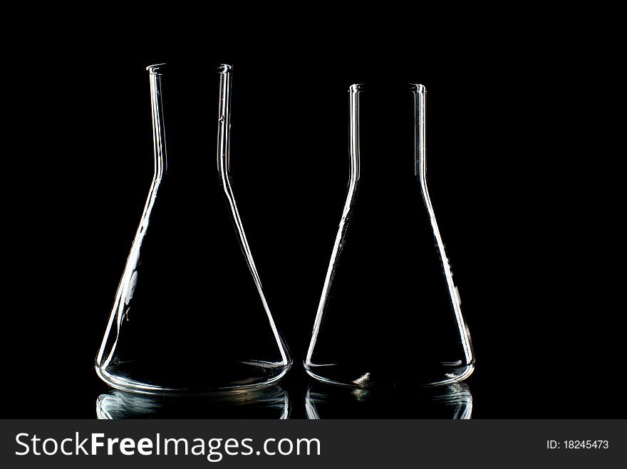 Two empty laboratory flasks. Studio shot.