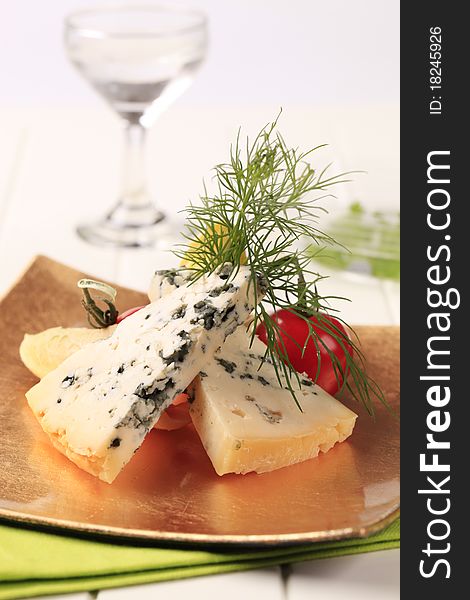 Blue cheese and fresh vegetables garnished with dill. Blue cheese and fresh vegetables garnished with dill