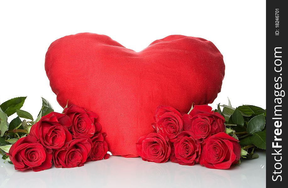 Big red heart with a bunch of a red roses isolated on white background