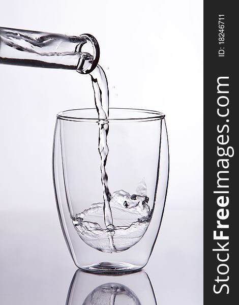 Shot of water falling into a glass. Shot of water falling into a glass.