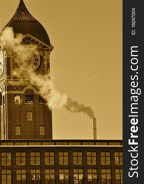 Pollution spewing into the air from industrial chimneys, in sepia (after and before). Pollution spewing into the air from industrial chimneys, in sepia (after and before)