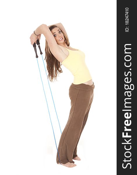 A woman is leaning back pulling on a jump rope. A woman is leaning back pulling on a jump rope.