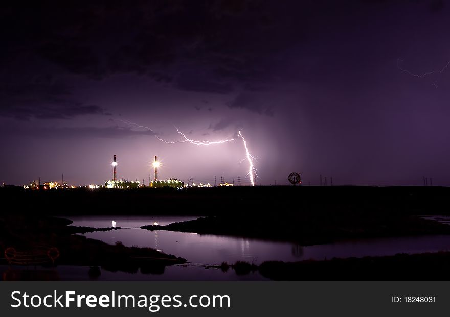 Lightning strikes near power station. Lightning strikes near power station