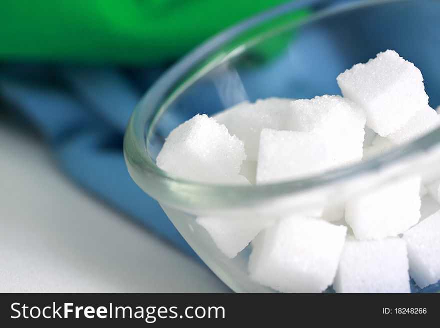 Sugar cube in clear bowl