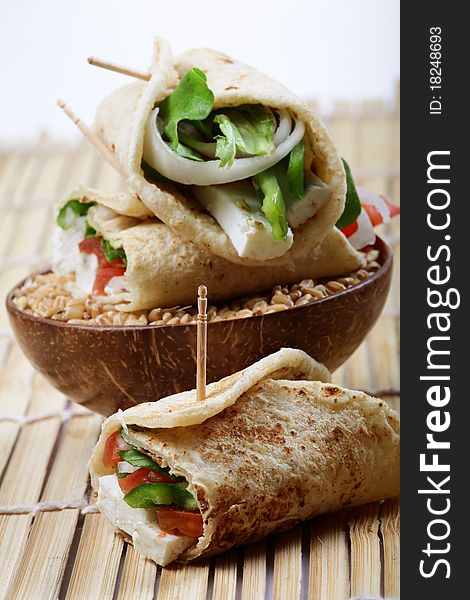 Veggie wheat rolls over wheat bowl.