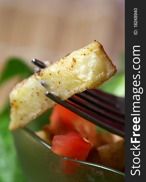 Macro shot of fried potato finger. Macro shot of fried potato finger.