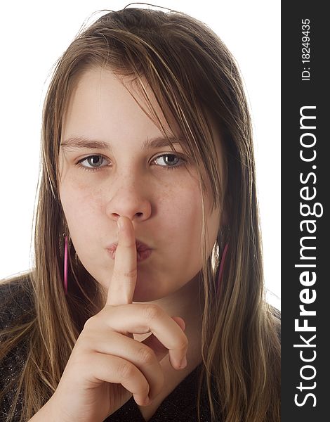 Portrait of a girl calling for silence, on a white background