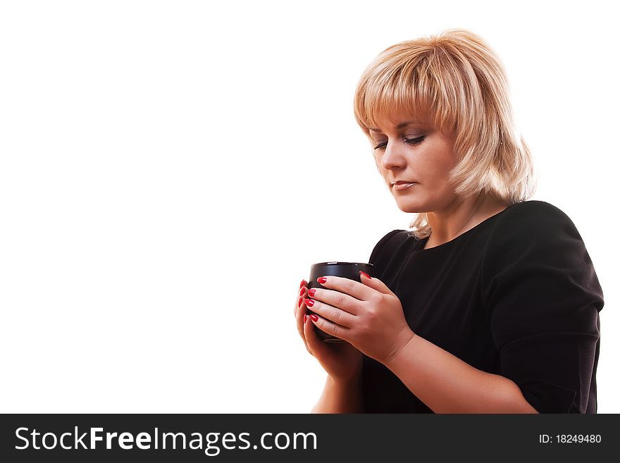 Woman's blonde holding a mug of hot tea on white background