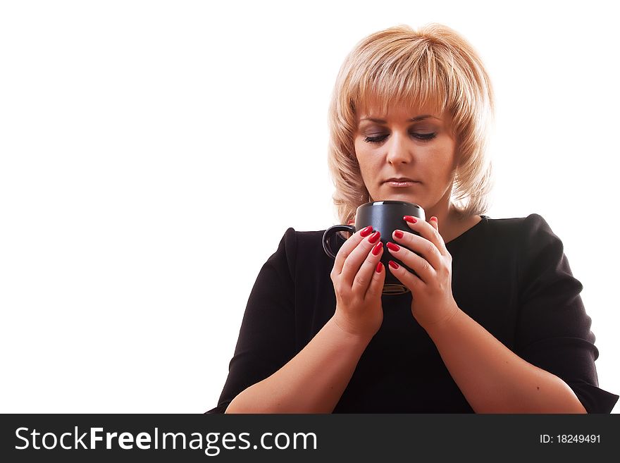 Woman's blonde holding a mug of hot tea on white background