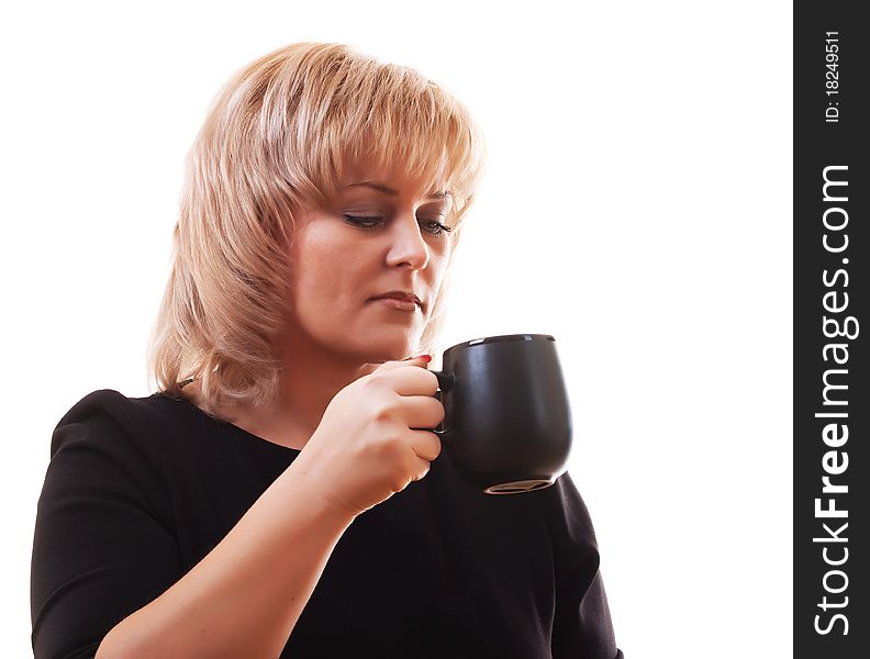 Woman's blonde holding a mug of hot tea on white background