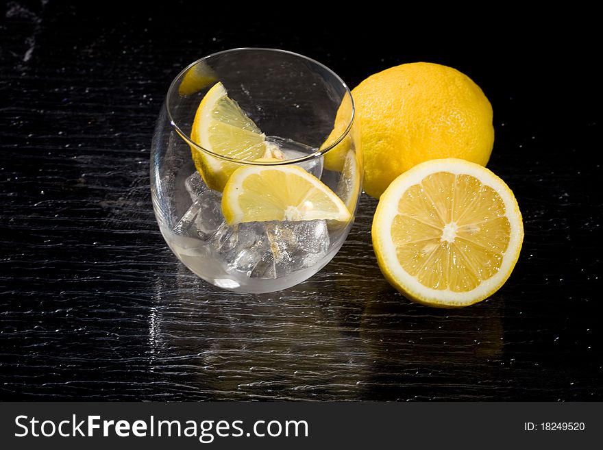 Photo of lemon on ice cubes. Photo of lemon on ice cubes